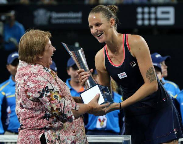 Karolina Pliskova receiving the her winning trophy from Wendy Turnbull.